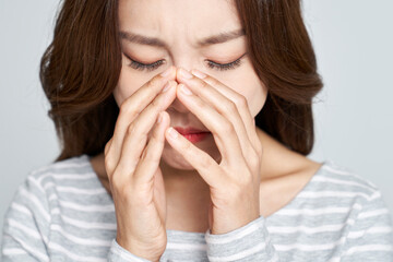 Young woman feeling depressed and sad with studio shot