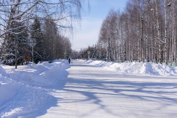 Winter snowy road in the village in russia