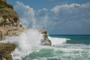 Fototapeta premium High wave breaking on the rocks of the coastline.