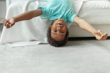 Happy kid boy having fun at home, portrait