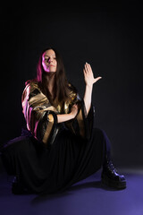 Stylish and daring image, futuristic fashion. A young woman in a multicultural outfit mixing Asian...