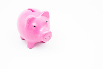 Pink piggy bank on isolated white background.