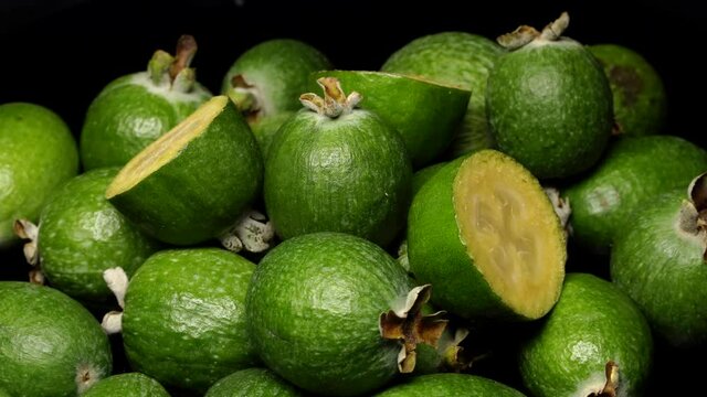 Acca sellowiana fruit (feijoa) rotation background. Close up