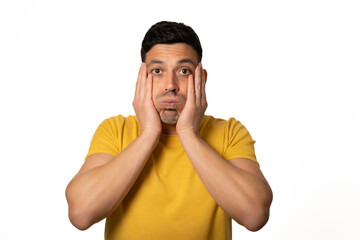 bored young man with hands on face. White background - Stock photo