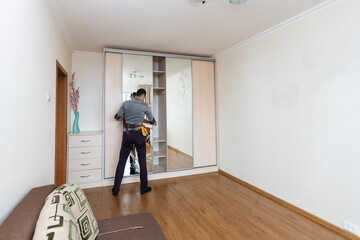 carpenter worker joint and settle home built-in cupboard