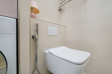 Fototapeta na wymiar bidet in modern toilet with wall mount shower attachment