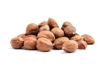 Raw shelled hezelnuts or filberts isolated on white