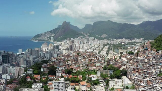 Aerial view Rio de Janeiro Brazil. Cityscape with a mountain landscape on the slopes of which are built favelas and new houses on the ocean with beaches.