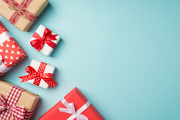 Top view photo of st valentine's day decorations stylish gift boxes with bows on isolated pastel blue background with copyspace