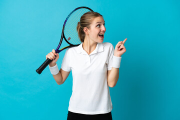 Young woman tennis player isolated on blue background intending to realizes the solution while lifting a finger up