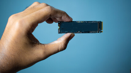 POV personal perspective male hand holds new M2 new Samsung NVME V-Nand SSD disk with one terabyte...