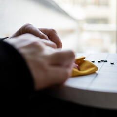Close-up view on the creative process of sewing doll, details of doll cloth sewing machine on the...
