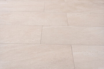 White tile floor background in perspective view. Clean surface and symmetry with grid line texture or pattern. For decoration in bathroom, kitchen and laundry room.