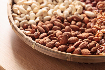 Various nuts on a wooden kitchen table.