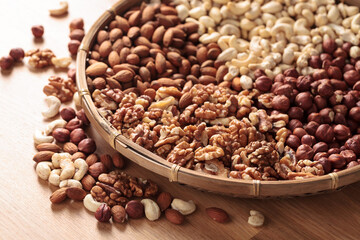 Various nuts on a wooden kitchen table.
