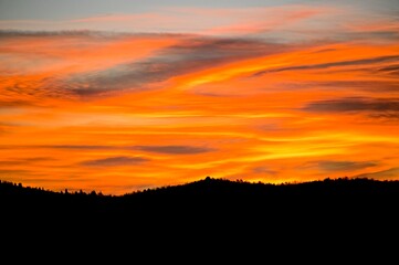 Fototapeta na wymiar Dramatic Sunrise Over the Hills of Tuscany Italy