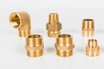 Brass fasteners for use in heating. fasteners and fittings on the white background