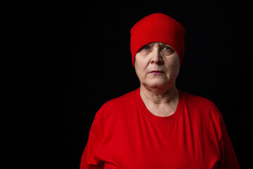 Grandmother in red on a black background.