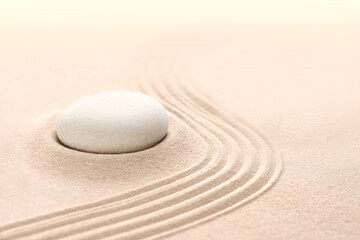 The yin and yang symbol. Balance. Good and evil. Stone garden for meditation. Japanese Zen concept. Buddhism and mindfulness. Concentration and concentration. Round stones on a sandy background. Philo