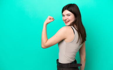 Young Russian woman isolated on green background doing strong gesture