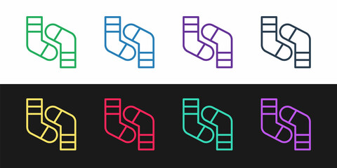 Set line Socks icon isolated on black and white background. Vector