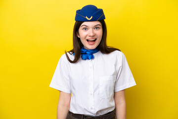 Airplane stewardess Russian woman isolated on yellow background with surprise facial expression