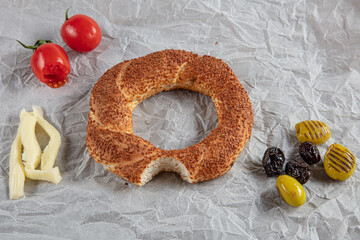 Close-up appetizing and crunchy bagels with sesame and flax seeds. Homemade hot baked goods. Simit...