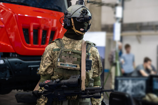 Mannequin in army uniform and equipment. Safety helmet and goggles. Special radio communication device. Modern warfare facilities.