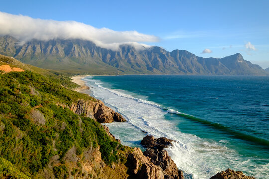 Beautiful coastal view of False bay and the Hottentots Holland mountains along the Clarence drive between Gordons Bay and Rooiels in the western cape, near Capetown in South Africa