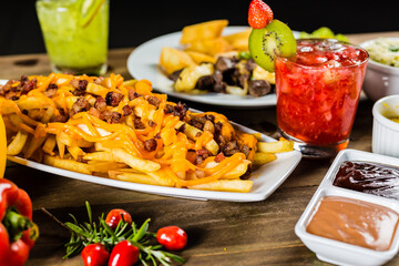 Colorful Food Appetizer Starts Snacks Fresh Delicious Menu Recipe Meal Meat Chicken Fries Fish Seafood Beer on a wooden table