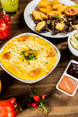 Colorful Food Appetizer Starts Snacks Fresh Delicious Menu Recipe Meal Meat Chicken Fries Fish Seafood Beer on a wooden table