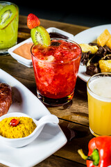 Colorful Food Appetizer Starts Snacks Fresh Delicious Menu Recipe Meal Meat Chicken Fries Fish Seafood Beer on a wooden table