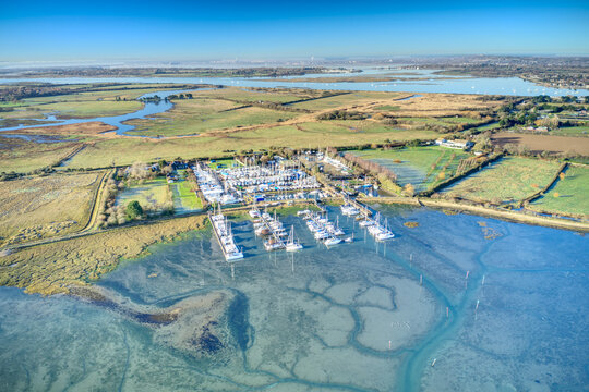 Thornham Marina full of yachts, situated in the Prinstead Estuary Channel on the Southern Coast of England, Aerial image.