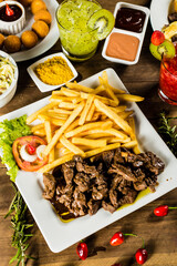 Colorful Food Appetizer Starts Snacks Fresh Delicious Menu Recipe Meal Meat Chicken Fries Fish Seafood Beer on a wooden table