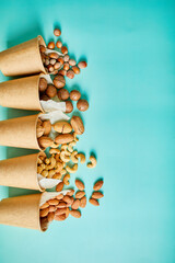 Assorted nuts in a in eco friendly cups, Rich in minerals and vegan protein, vitamins and antioxidants for immune system boosting. Healthy nutrition, high in zinc, magnesium, online ordering, shoping.