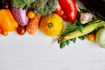 Top view assorted fresh organic vegetables on table in the kitchen in sunlight, grocery healthy shopping, vegan foodб flat lay, copy space. Layout with free text