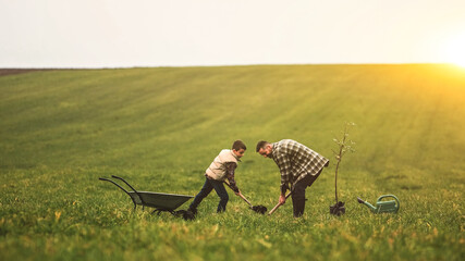 Father and his son working in the field