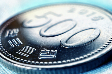 Translation: Bank of Korea. 500 won coin close-up. Bright tinted illustration on an economic,...