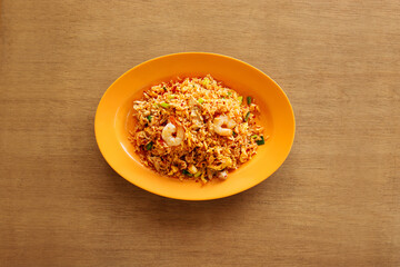 sambal fried rice with chili paste and raw onion on wood background top view rice 