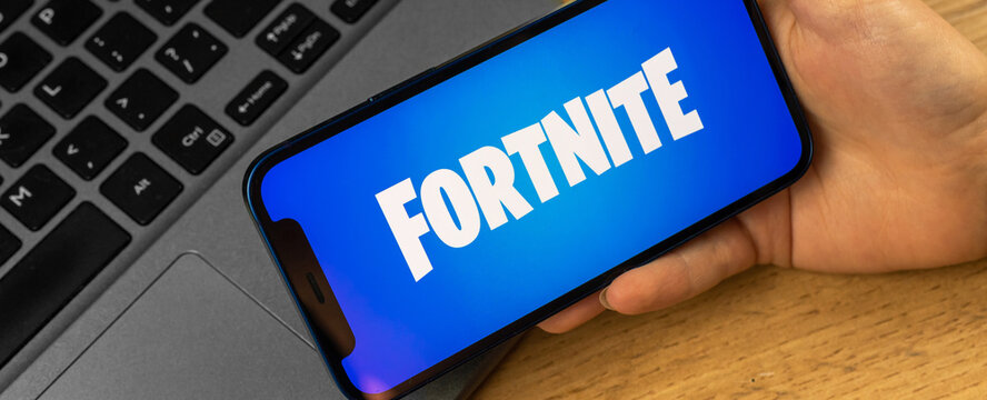 Apple iPhone with Fortnite logo, banner, close-up