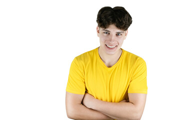 Fototapeta premium On a white background a portrait of a happy teenager 16-18 years old, the guy is smiling and looking hopefully into the future, the guy has dark hair and healthy white teeth