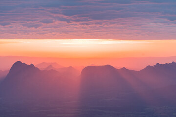 Sunrise with cloudy and blue sky background. Nature and outdoor background in national park at Thailand