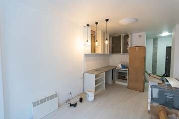 Renovated kitchen interior with stylish furniture and maintenance equipment