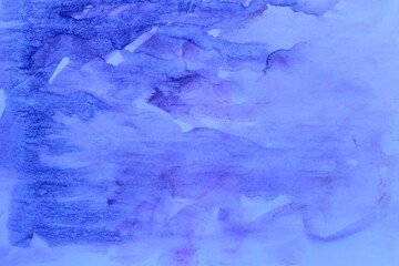 blue watercolor background. Transparent lines and spots. Paint leaks and ombre effects. Abstract hand-painted image.