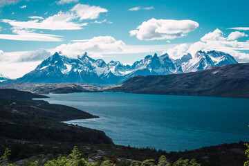 View of a mountain lake with snowy peaks in the background in the Chilean Patagonia area
