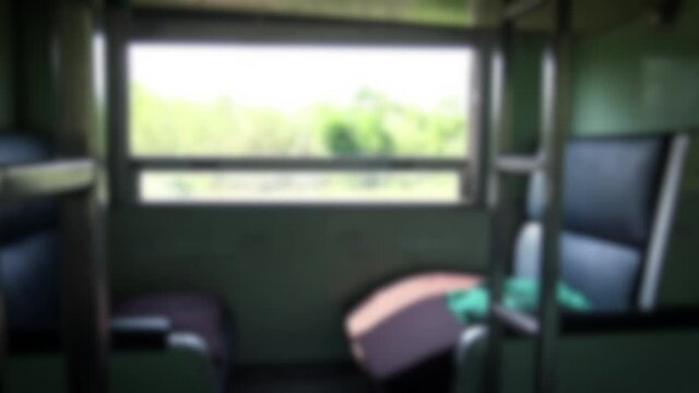 Blurred defocused inside an empty Sleeping Car Of Passenger Train Compartment. Train Begins In Bangkok Go To Chiang Mai. Traveling Passenger Train Countryside 