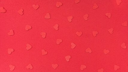 Red background with paper hearts. Advertising banner concept for Valentine's Day. Valentine's day concept background for postcard, sale banner, advertisement.