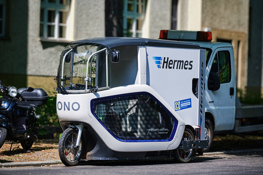 Berlin, Germany - July 3, 2021: An electrically powered cargo bike called Pedal Assisted Transporter (PAT) from the logistics service provider Hermes Germany in use in downtown Berlin.