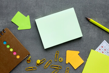 blank notepad with pen and notebook on wooden background