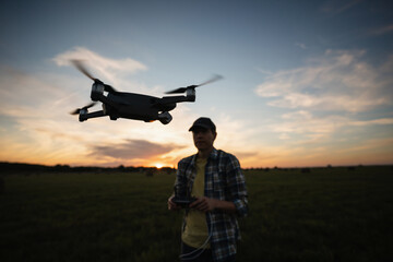 Fototapeta na wymiar Farmer with drone on a field. Smart farming and precision agriculture
